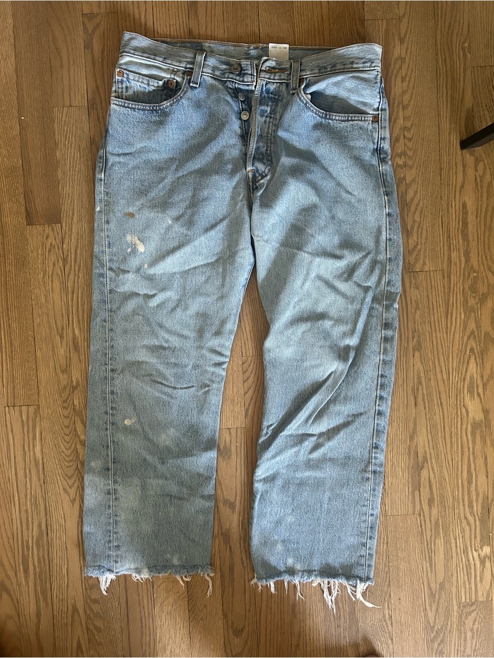 Levi's Light Wash Relaxed Straight Jeans with Distressed Hem